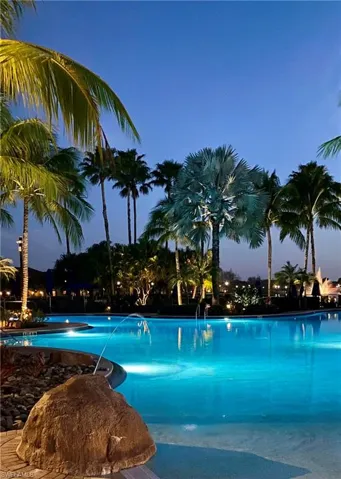 View of pool at dusk