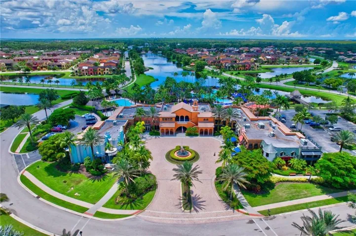 Birds eye view of property with a water view