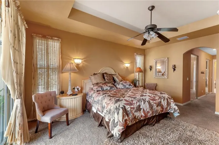 Bedroom featuring carpet flooring and ceiling fan