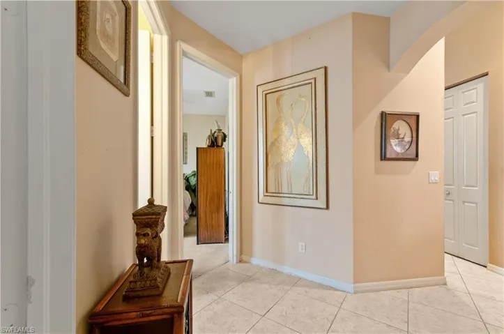 Hall with light tile patterned floors