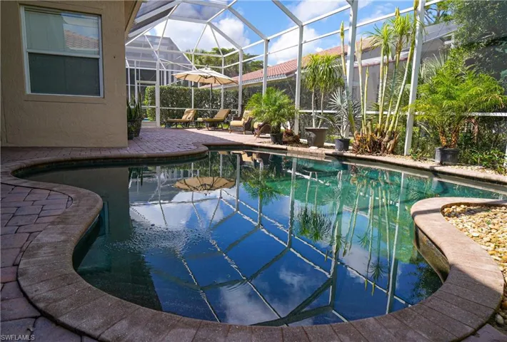 View of pool featuring a lanai and a patio area