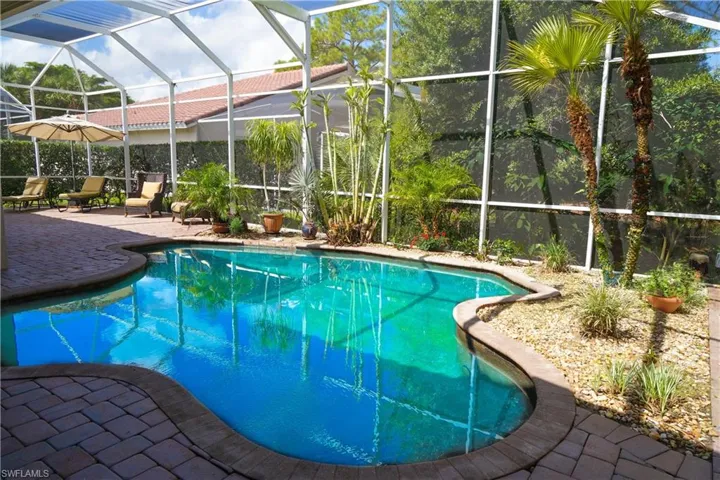 View of pool featuring a lanai and a patio area