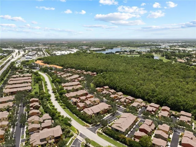 Aerial view of property's location with nearby suburban area and a large body of water