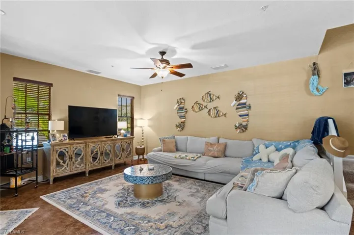 Living area featuring ceiling fan