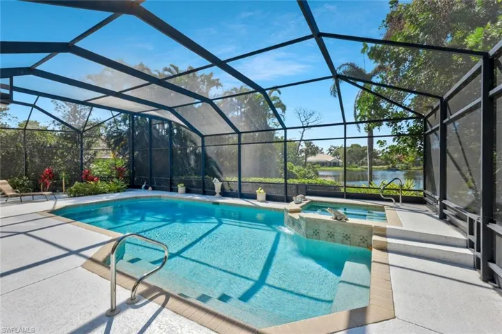 Luxurious screened lanai and pool, perfect for relaxation and entertaining.