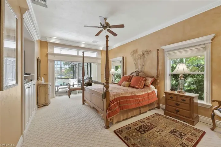 Spacious primary bedroom suite with private access to the lanai.