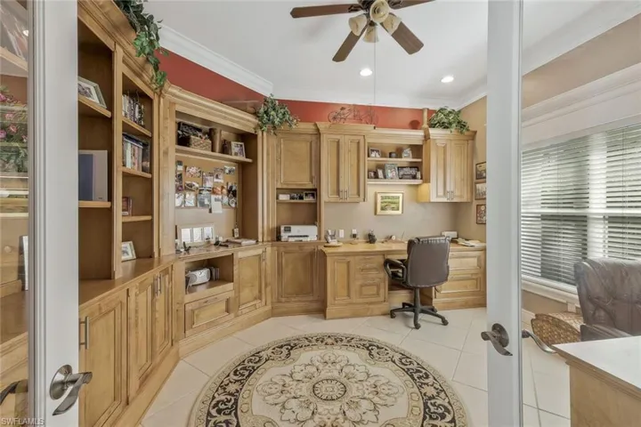 Custom-built library or reading nook with wall-to-wall shelving.