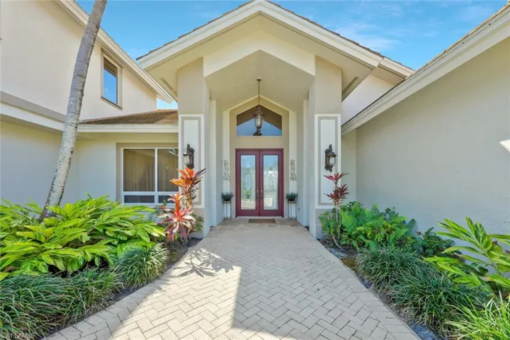 Welcoming front entryway with charming architectural details.
