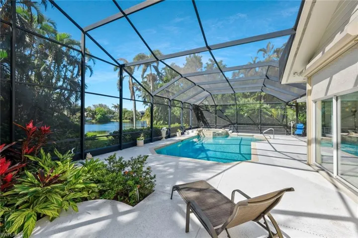 Stunning pool deck with scenic views of the lush landscape.