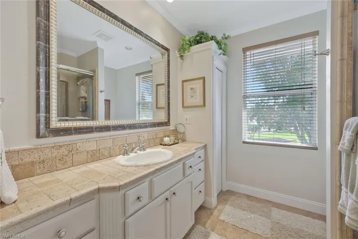Guest bathroom with an abundance of counter space and storage.