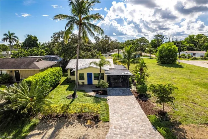 View of front of home featuring New driveway and a front yard