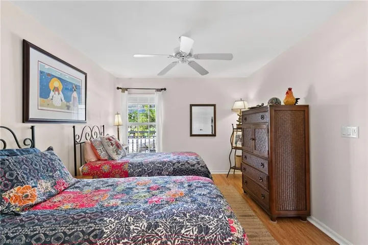 Bedroom featuring ceiling fan and light wood-type flooring