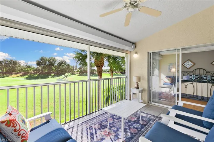 Sunroom featuring lofted ceiling and ceiling fan