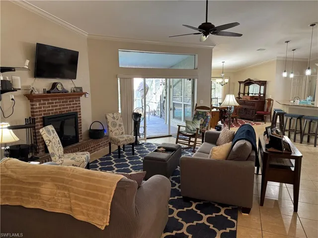 Outdoor pool featuring a sunroom, a patio, an outdoor hangout area, and a lanai