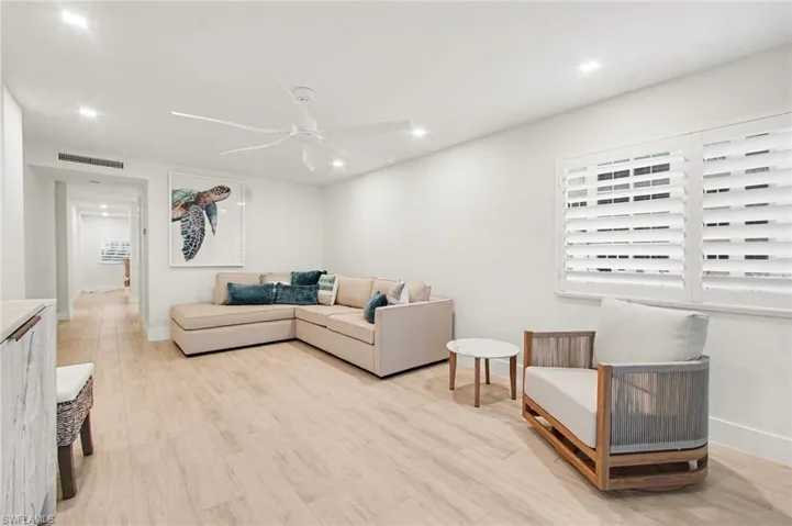 Light wood-finish flooring throughout the space