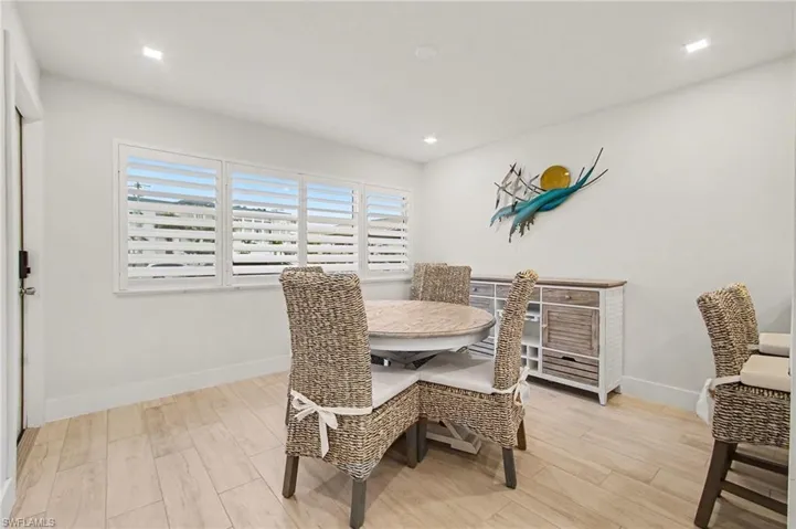 Bright interior featuring light-toned wood-finish flooring