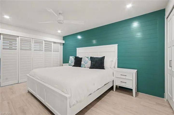 Bedroom featuring light wood-finish flooring and recessed lighting