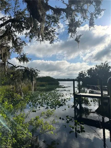 Property view of water featuring a boat dock