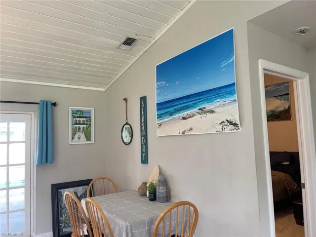 Dining room featuring a beach view and baseboards