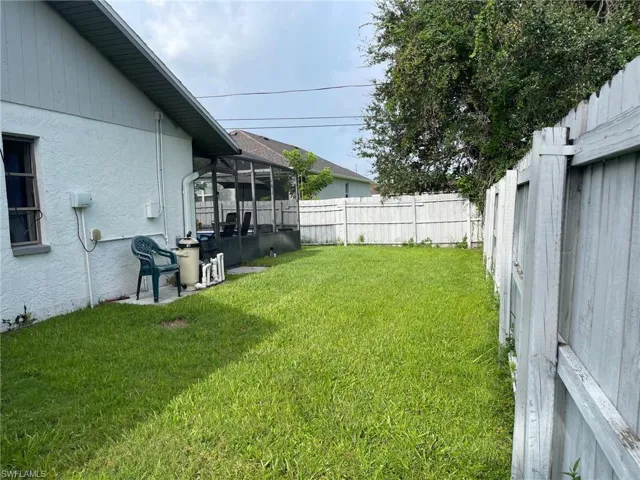 View of yard with a sunroom