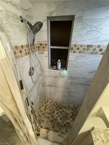 Bathroom with a tile shower