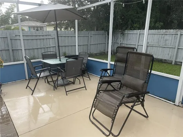 Sunroom / solarium featuring outdoor dining space