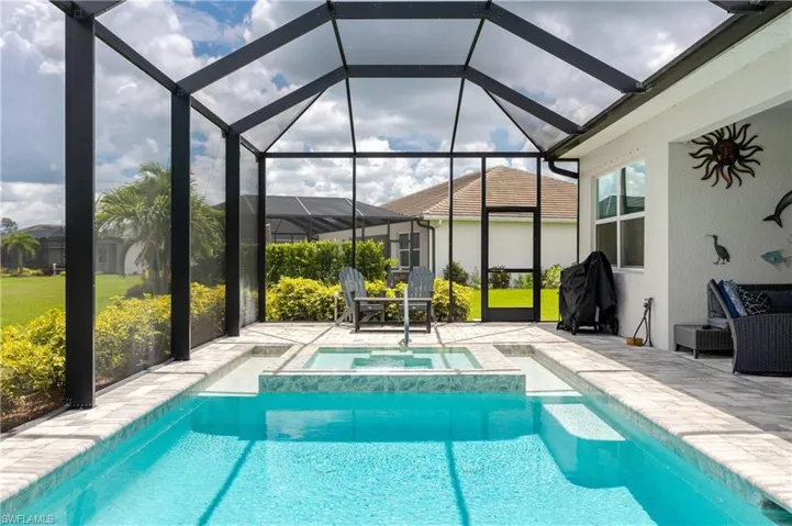 View of pool featuring a lanai and a patio area