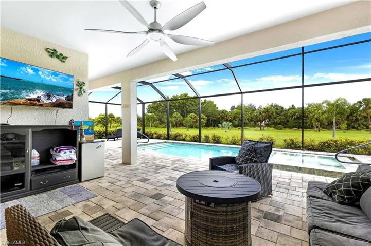 View of patio / terrace featuring ceiling fan and glass enclosure