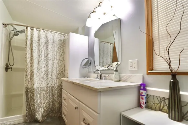 Bathroom with vanity and walk in shower