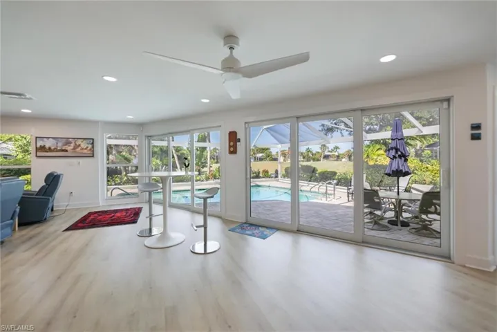 Dining space with plenty of natural light, light wood finished floors, recessed lighting, and ceiling fan