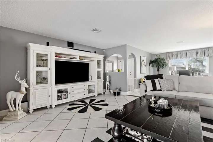 Living room  and light tile patterned flooring