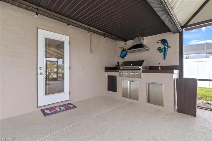 View of patio / terrace with an outdoor kitchen and a grill