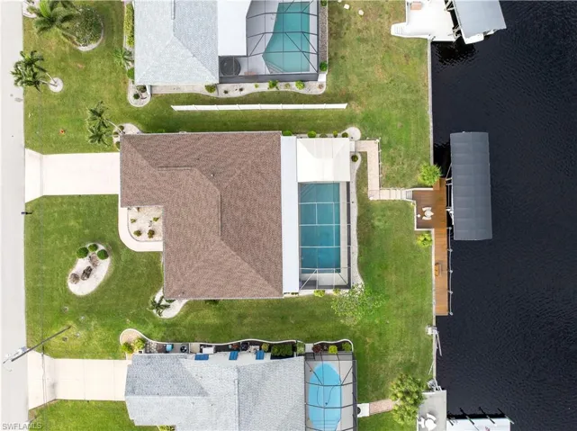 Drone / high direct aerial view of propety with a water view