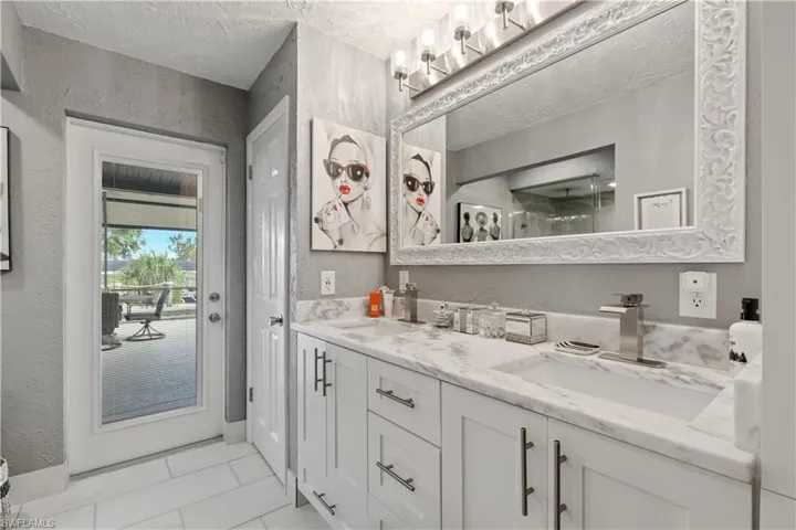 Primary Bathroom with vanity and linen closet