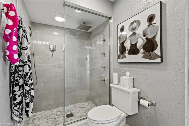 Primary Bathroom with toilet and shower