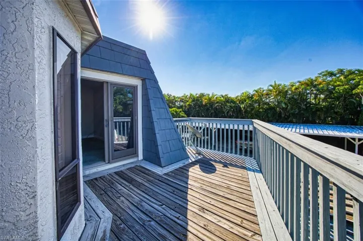 Wooden terrace with view of scattered trees