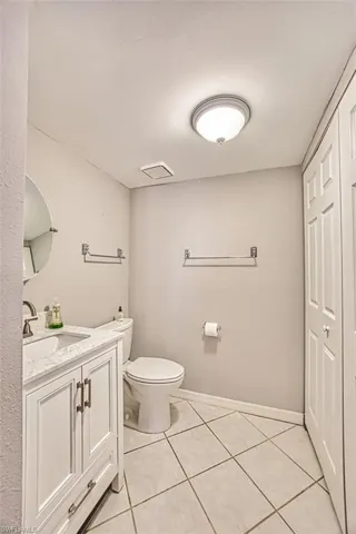 Bathroom with vanity and light tile patterned flooring