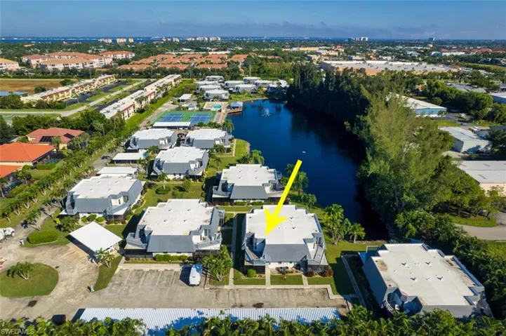 Aerial overview of property's location featuring a nearby body of water