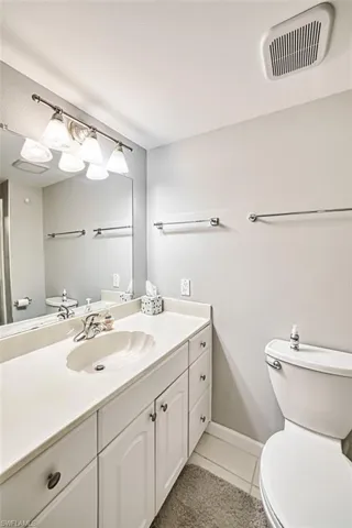 Bathroom with vanity and light tile patterned flooring