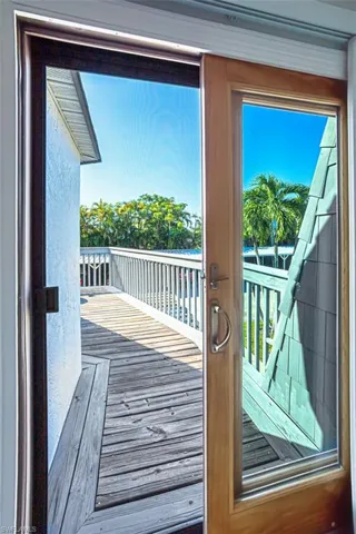 Doorway to outside with wood finished floors