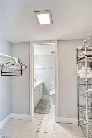 Bathroom with vanity and light tile patterned floors