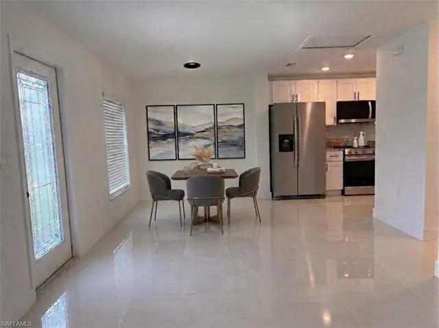 Kitchen/dining area. Virtually staged for illustrative purposes. No physical furnishings are present.