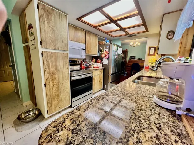 Kitchen with GRANITE tops and all appliances.