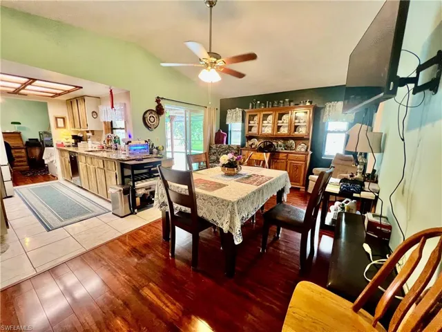 Family room with cathedral ceilings being used as a large formal dining room.