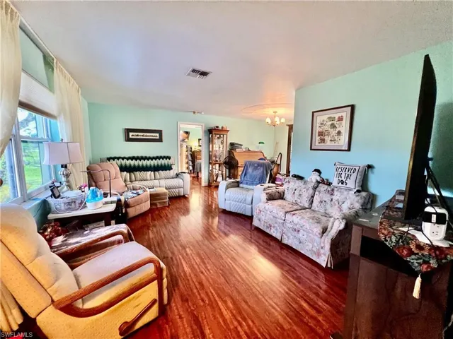 Living area with wood finished floors.