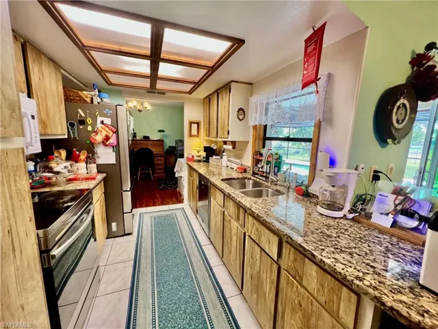 Kitchen with GRANITE tops and all appliances.