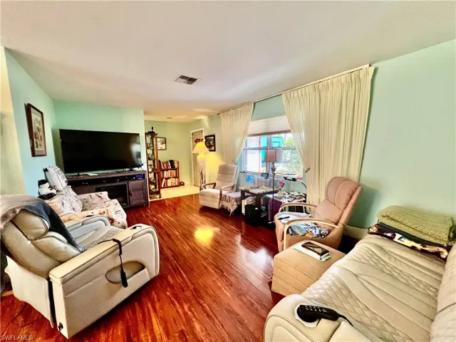 Living area with wood finished floors.