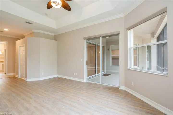 Owners' suite with cove ceiling and fan