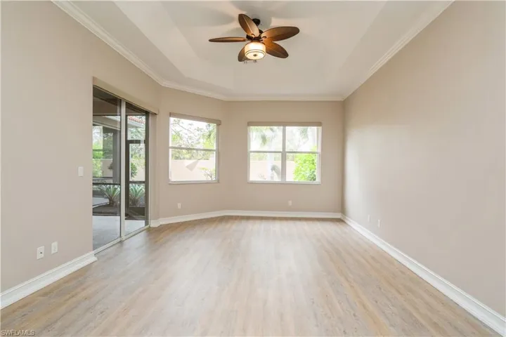 Spacious owners' bedroom with slider to lanai