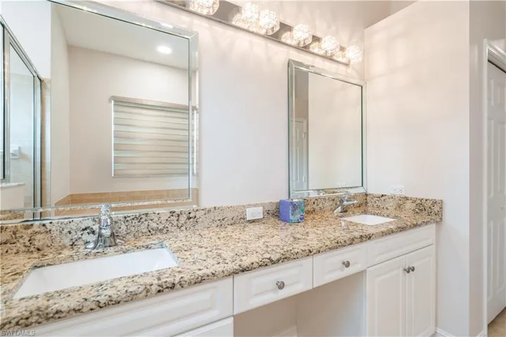 Owners' bathroom with double vanities